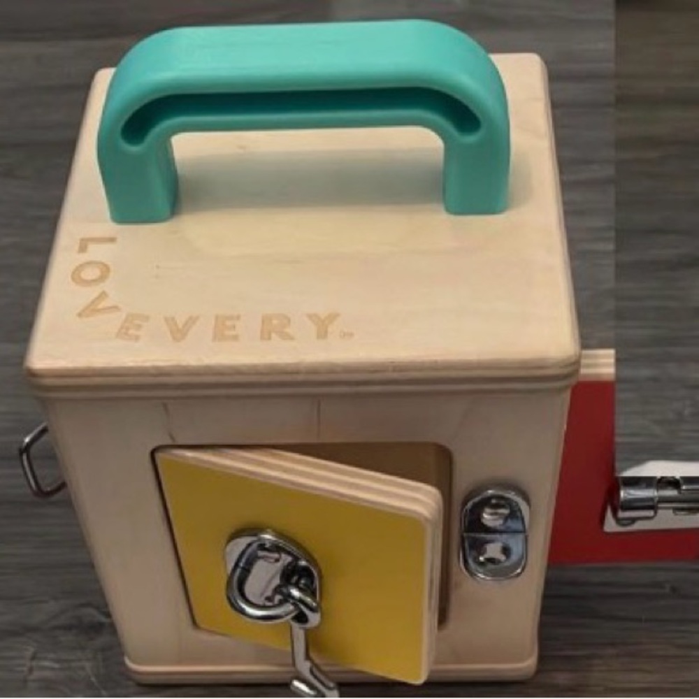 Lovevery Wooden Learning Toy with Yellow and Teal Accents